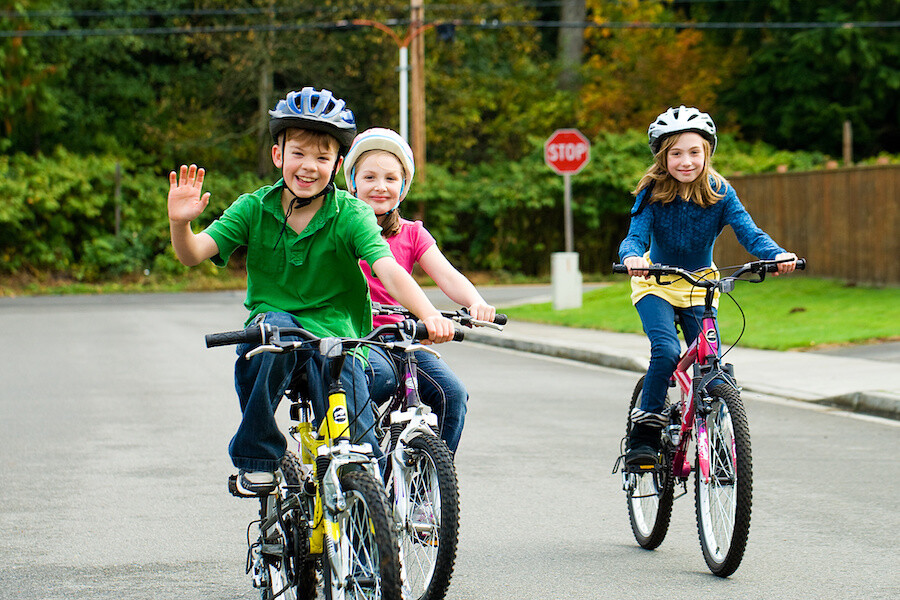 kids on bikes with helmets