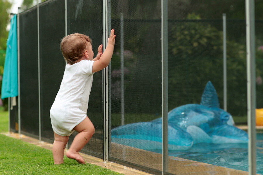 toddler trying to get into the pool