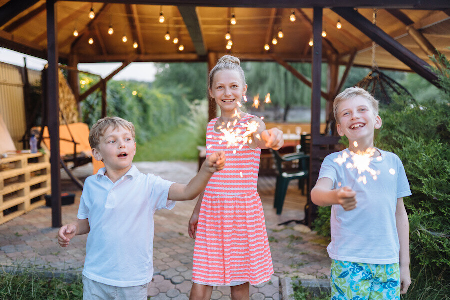 kids playing with sparklers