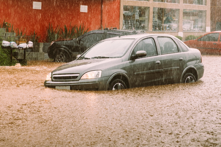 Car submerged in flood waters.
