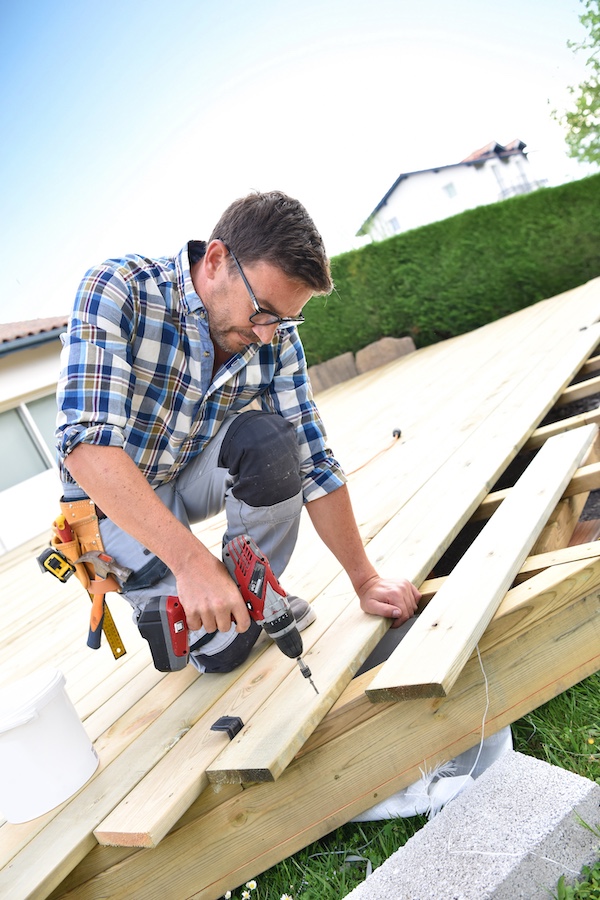 man constructing new deck