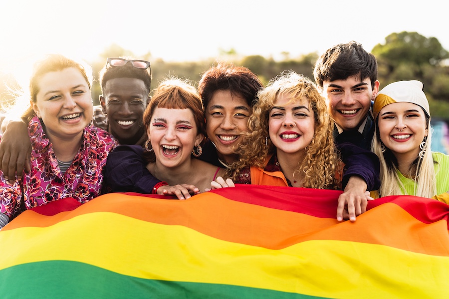 Diverse young friends celebrating gay pride festival