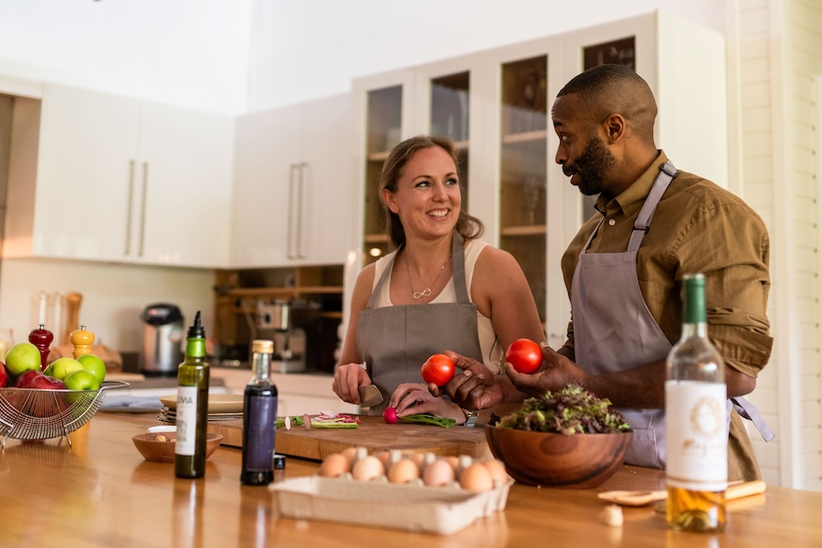Couple cooking together happily