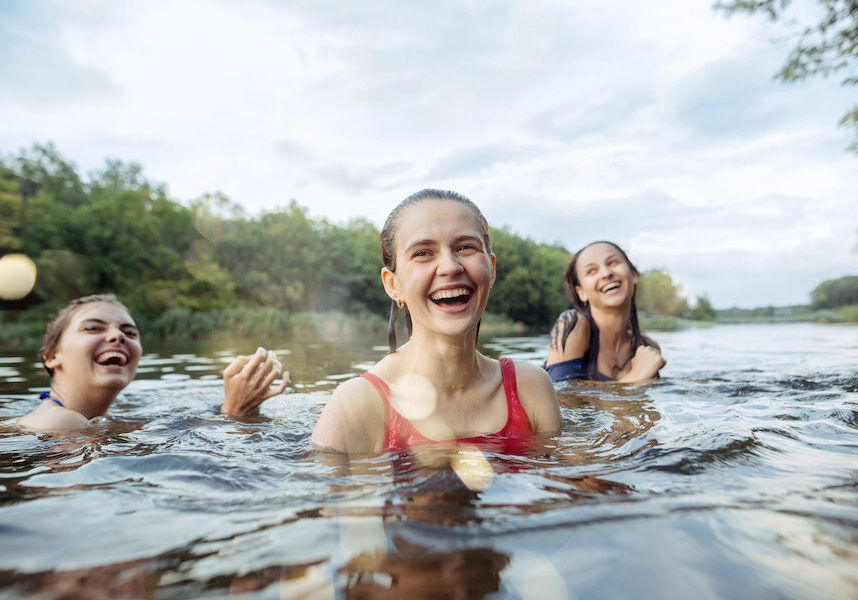 girls swimming in a river