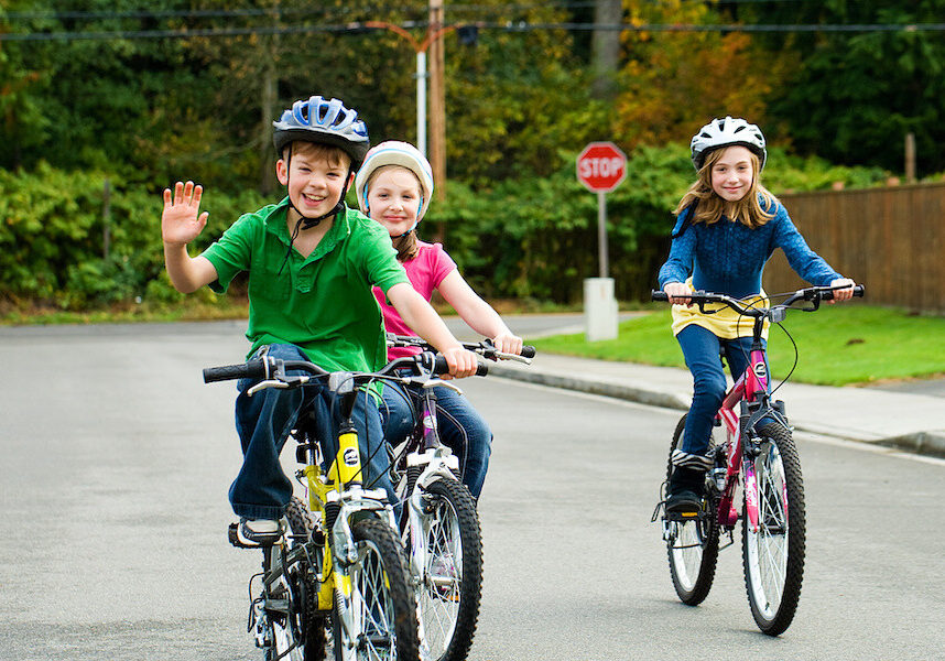 kids on bikes with helmets