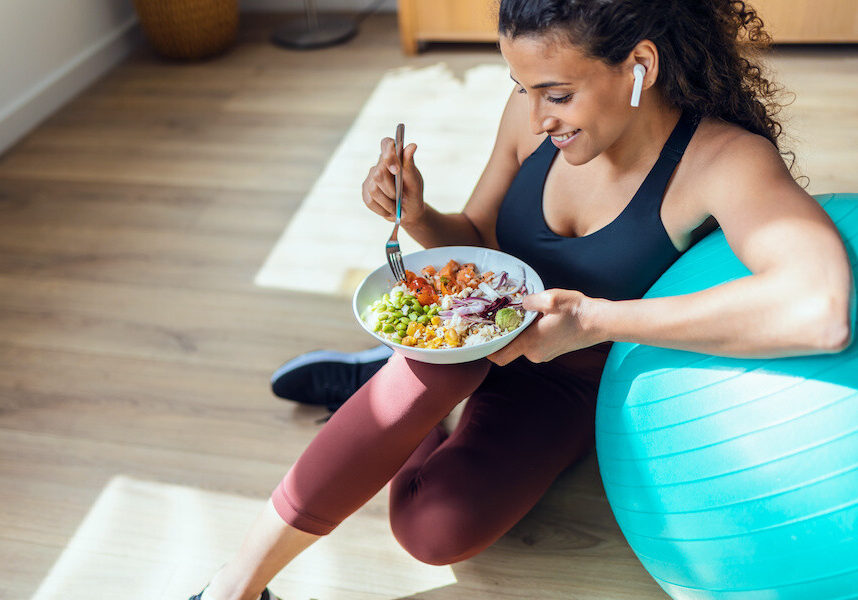 woman eating healthy after exercising