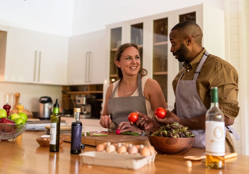 Couple cooking together happily