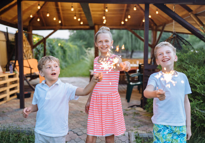 kids playing with sparklers