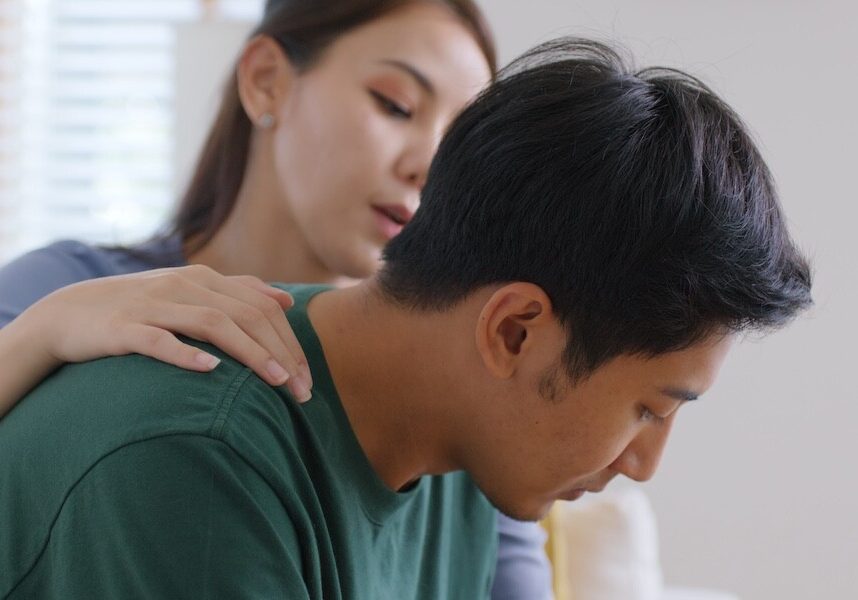 young people stress relief trust talk share suffer cancer pain sick family loss bad news crisis. Sorrow cry man and carer woman sit at sofa home help listen by love hold hand warm hug touch wife.
