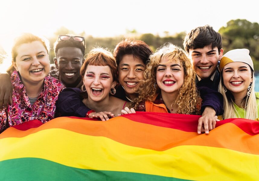 Diverse young friends celebrating gay pride festival